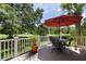 Relaxing deck area with outdoor seating and views of the golf course and lush greenery at 914 Red Coat Run, Mount Pleasant, SC 29464