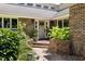 Inviting front entrance with brick steps and planters, leading to a well-maintained brick facade at 914 Red Coat Run, Mount Pleasant, SC 29464
