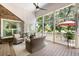 Inviting screened porch with comfortable seating and views of the landscaped yard at 914 Red Coat Run, Mount Pleasant, SC 29464