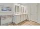 Well-lit bathroom with double vanity, stylish mirrors, and ample storage creating a functional and appealing space at 9808 Wooden Pestle Way, Ladson, SC 29456