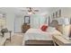Light-filled bedroom with a ceiling fan, neutral tones, and inviting furnishings for a comfortable and relaxing retreat at 9808 Wooden Pestle Way, Ladson, SC 29456