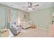 Charming Bedroom with a crib, rocking chair, and soft lighting, perfect for a peaceful and nurturing environment at 9808 Wooden Pestle Way, Ladson, SC 29456