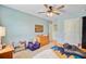 A nice view of the bedroom with a bed, fan, and carpet flooring at 9808 Wooden Pestle Way, Ladson, SC 29456