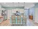 Kitchen with stainless steel appliances, island with granite countertop, and pendant lighting at 9808 Wooden Pestle Way, Ladson, SC 29456