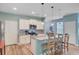 Bright kitchen featuring a center island with counter seating and stainless steel appliances at 9808 Wooden Pestle Way, Ladson, SC 29456