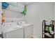 Well organized laundry room features modern appliances and storage space at 9808 Wooden Pestle Way, Ladson, SC 29456