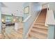 View of living space from staircase; open floor plan with hardwood floors, lots of light at 9808 Wooden Pestle Way, Ladson, SC 29456