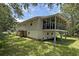 Exterior shot of a home with a screened-in back porch at 1014 E Cooper Ave, Folly Beach, SC 29439