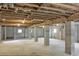 Unfinished basement with concrete columns and exposed ceiling beams at 1014 E Cooper Ave, Folly Beach, SC 29439