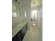 Elegant bathroom featuring a modern vanity, marble countertops, and a serene ambiance at 1014 E Cooper Ave, Folly Beach, SC 29439