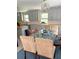 Bright dining area features a glass table and unique chandelier, offering a modern and stylish eating space at 1014 E Cooper Ave, Folly Beach, SC 29439