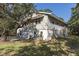 Exterior shot of home with garage, driveway, and side yard at 1014 E Cooper Ave, Folly Beach, SC 29439