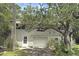 Two-story home with a driveway and mature landscaping at 1014 E Cooper Ave, Folly Beach, SC 29439