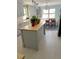 Kitchen with an island, gray cabinets and butcher block countertops at 1014 E Cooper Ave, Folly Beach, SC 29439