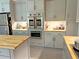 Kitchen featuring stainless steel appliances and gray cabinets at 1014 E Cooper Ave, Folly Beach, SC 29439