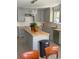 Bright kitchen with gray cabinets, butcher block countertops and an island at 1014 E Cooper Ave, Folly Beach, SC 29439