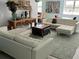 This stylish living room has white sofas, a decorative table, and eclectic art for a modern, inviting space at 1014 E Cooper Ave, Folly Beach, SC 29439