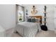 Well-lit bedroom with modern light fixture and views to the front yard at 1035 Tea Time Dr, Summerville, SC 29485