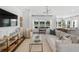 Bright living room with stylish furnishings, modern lighting, and scenic views from the expansive windows at 1035 Tea Time Dr, Summerville, SC 29485