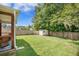 Large backyard with a shed, screened-in patio, and wooden fence at 105 Lovette Ct, Goose Creek, SC 29445