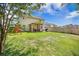 Spacious backyard with a playground set and screened-in patio at 105 Lovette Ct, Goose Creek, SC 29445