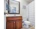 Bathroom featuring single sink vanity with a framed mirror, and shower with blue patterned shower curtain at 105 Lovette Ct, Goose Creek, SC 29445