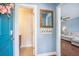 Inviting entryway features a colorful front door, coat hooks and a glimpse into the living room at 105 Lovette Ct, Goose Creek, SC 29445