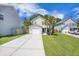Charming two-story home featuring a manicured lawn, garage, and beautiful landscaping at 105 Lovette Ct, Goose Creek, SC 29445