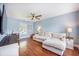 Bright living room with a comfortable sectional sofa, hardwood floors, and a ceiling fan at 105 Lovette Ct, Goose Creek, SC 29445