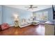 Spacious living room featuring hardwood floors, a comfy white sofa, and lots of natural light at 105 Lovette Ct, Goose Creek, SC 29445