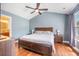 Spacious main bedroom with wood floors, ceiling fan, vaulted ceiling, and ensuite bathroom at 105 Lovette Ct, Goose Creek, SC 29445