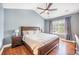 Comfortable main bedroom with natural light, ceiling fan, wood floors, and ensuite bathroom access at 105 Lovette Ct, Goose Creek, SC 29445