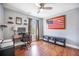Office with wood floors, natural light, desk, storage, and American flag wall art at 105 Lovette Ct, Goose Creek, SC 29445