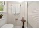 Functional bathroom with a toilet and shower with glass door, ensuring a convenient and private space at 105 Spring St, Summerville, SC 29485
