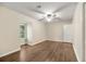 Bright bedroom featuring laminate flooring, a ceiling fan, a window, and neutral paint at 105 Spring St, Summerville, SC 29485