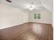 Spacious bedroom featuring laminate flooring, a ceiling fan, a window, and ample natural light at 105 Spring St, Summerville, SC 29485
