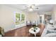 Inviting living room with hardwood floors, French doors, and a cozy seating area, creating a warm and welcoming atmosphere at 105 Spring St, Summerville, SC 29485