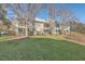 Expansive backyard featuring a well-maintained lawn, mature trees, and a multi-level deck at 1158 Village Creek Ln # 4, Mount Pleasant, SC 29464