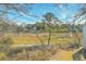 Scenic backyard view featuring a pond, marshland, and several houses at 1158 Village Creek Ln # 4, Mount Pleasant, SC 29464