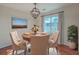 Cozy dining room with chandelier, natural light, and elegant decor at 1158 Village Creek Ln # 4, Mount Pleasant, SC 29464