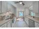 Bright, well-lit kitchen featuring white cabinetry and an open view into the dining area at 1158 Village Creek Ln # 4, Mount Pleasant, SC 29464