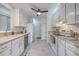 Bright kitchen with white appliances, ample cabinet space, and a ceiling fan at 1158 Village Creek Ln # 4, Mount Pleasant, SC 29464