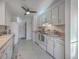 Traditional-style kitchen featuring white cabinets, appliances, and a ceiling fan at 1158 Village Creek Ln # 4, Mount Pleasant, SC 29464