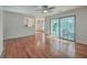 Spacious living room with hardwood floors, ceiling fan, and sunroom access at 1158 Village Creek Ln # 4, Mount Pleasant, SC 29464