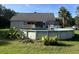 Backyard with above ground pool, lush lawn, and tropical landscaping at 1173 Penny Creek Dr, Ruffin, SC 29475