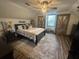 Bedroom with a dark bed frame, industrial-style doors, and a soft shag rug at 1173 Penny Creek Dr, Ruffin, SC 29475