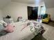 Cozy bedroom with floral bedding, a sitting area, and an open doorway to the rest of the home at 1173 Penny Creek Dr, Ruffin, SC 29475