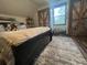 Charming bedroom featuring a comfortable bed, industrial-style doors, and plenty of natural light at 1173 Penny Creek Dr, Ruffin, SC 29475