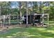 A rustic chicken coop with chickens and ducks in a grassy yard at 1173 Penny Creek Dr, Ruffin, SC 29475