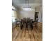 Bright dining room with modern light fixture and a view from the window at 1173 Penny Creek Dr, Ruffin, SC 29475